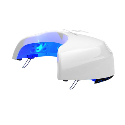 White nail dryer with blue light on a white background